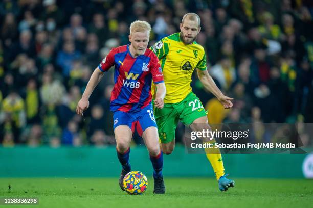 Will Hughes of Crystal Palace and Teemu Pukki of Norwich City in action during the Premier League match between Norwich City and Crystal Palace at...