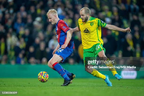 Will Hughes of Crystal Palace and Teemu Pukki of Norwich City in action during the Premier League match between Norwich City and Crystal Palace at...