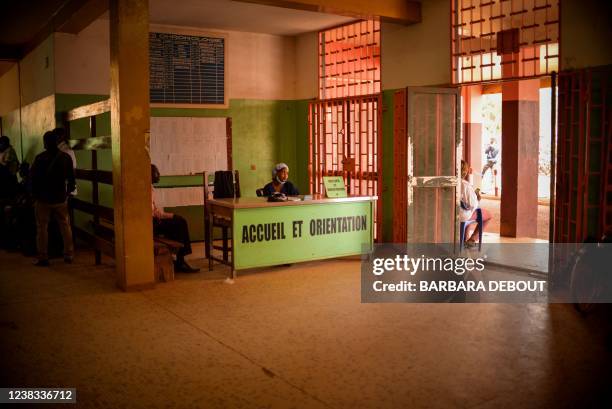 Receptionist is seen at the entrance of the community hospital in Bangui,on January 27, 2022. - In the Central African Republic, the second least...