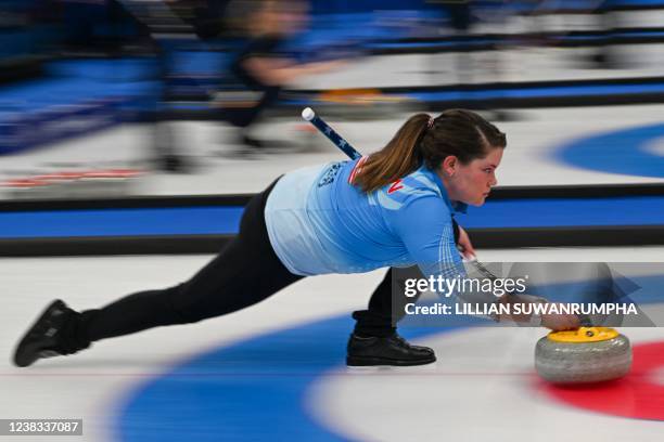 Rebecca Hamilton of the US curls the stone during the women's round robin session 1 game of the Beijing 2022 Winter Olympic Games curling competition...