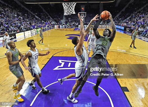 Jonathan Tchamwa Tchatchoua of the Baylor Bears takes a shot against Davion Bradford of the Kansas State Wildcats, during the second half at Bramlage...