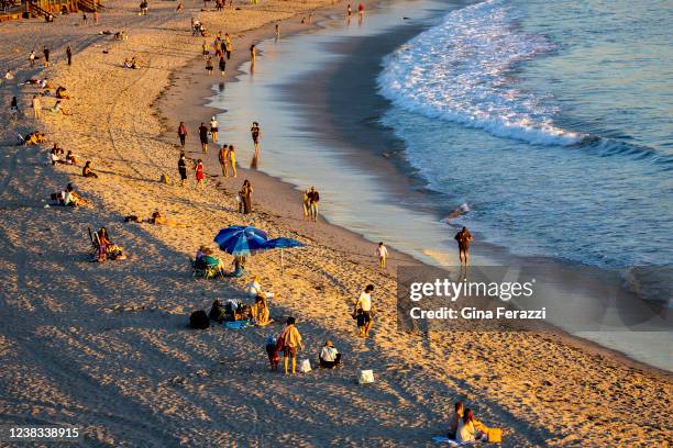 Warm temperatures brings crowds to Main Beach on February 9, 2022 in Laguna Beach, California. The National Weather service has declared a heat...