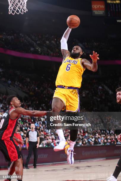 LeBron James of the Los Angeles Lakers dunks the ball during the game against the Portland Trail Blazers on February 9, 2022 at the Moda Center Arena...
