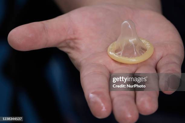 An internal condom is held by a person inside the facilities of Utopia Tezontli in Iztapalapa, Mexico City, where information was provided on the...