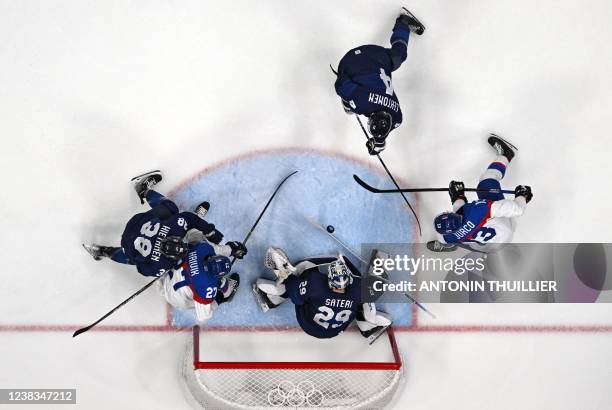 Finland's goaltender Harri Sateri defends his goal during the men's preliminary round group C match of the Beijing 2022 Winter Olympic Games ice...
