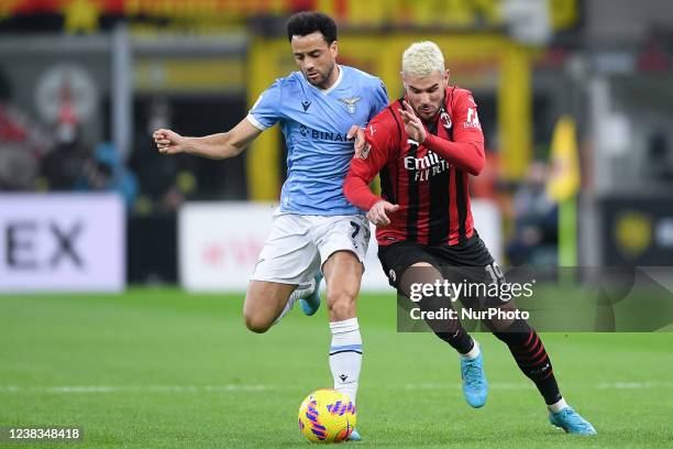 Felipe Anderson of SS Lazio and Theo Hernandez of AC Milan compete for the ball during the Italian Cup match between AC Milan and SS Lazio at Stadio...