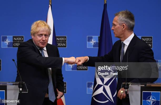 British Prime Minister Boris Johnson and NATO Secretary General Jens Stoltenberg hold a joint press conference following a meeting at the NATO...