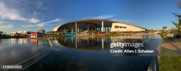 Los Angeles, CA Workers make last minute preparations for the Super Bowl as viewed from the lake at SoFi Stadium in Los Angeles Wednesday, Feb. 9,...