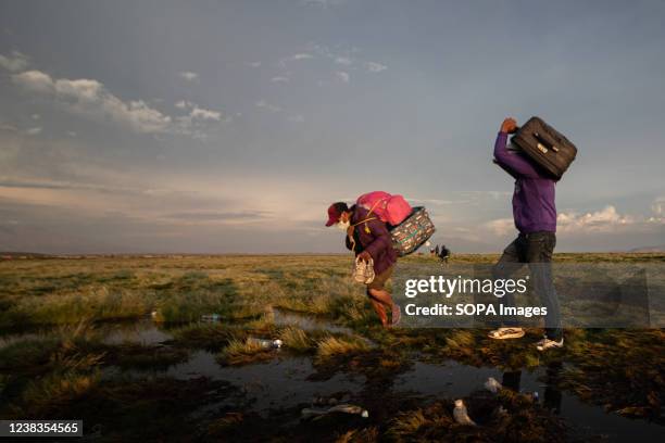 Daily occurrence Venezuelan migrants seen walking on adverse roads to reach Chile, across the Bolivian border, near Colchane. Venezuelan migrants...