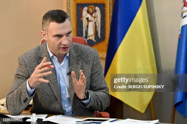 Heavyweight boxing champion, turned Kyiv mayor Vitali Klitschko, talks with AFP journalists at his office in Kyiv on February 10, 2022. - Vitali...