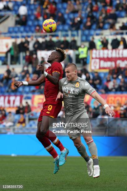 Tammy Abraham heads the ball against Leo Østigård during the Serie A match between AS Roma and Genoa Cricket and Football Club at Stadio Olimpico....
