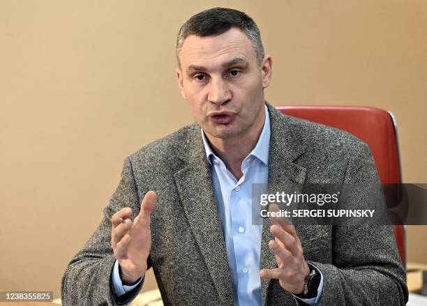 Heavyweight boxing champion, turned Kyiv mayor Vitali Klitschko, talks to AFP journalists at his office in Kyiv on February 10, 2022. - Vitali...