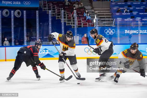 Eric O´dell of Canada, Yasin Ehliz of Germany, Matthias Plachta of Germany, Moritz Mueller of Germany at the men's ice hockey group A preliminary...