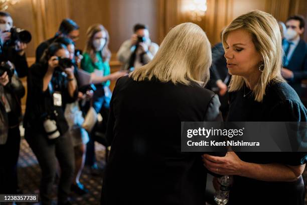 Former Fox News anchor Gretchen Carlson speaks with Sen. Kirsten Gillibrand following a news conference on the passage of the Ending Forced...