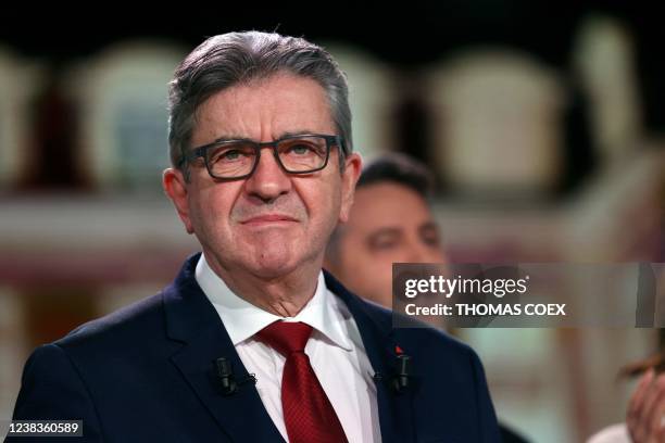 France's leftist movement La France Insoumise party leader, MP and candidate for the 2022 presidential election Jean-Luc Melenchon looks on before...