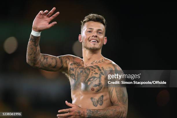 Shirtless Ben White of Arsenal reveals a tattoo of a tiger on his chest after the Premier League match between Wolverhampton Wanderers and Arsenal at...