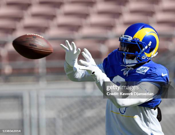 Wide receiver Odell Beckham Jr. #3 of the Los Angeles Rams catches the football during practice in preparation for Super Bowl LVI at the Rose Bowl on...