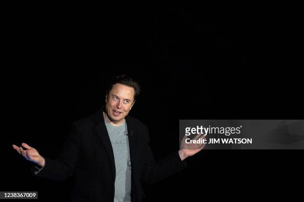 Elon Musk gestures as he speaks during a press conference at SpaceX's Starbase facility near Boca Chica Village in South Texas on February 10, 2022....