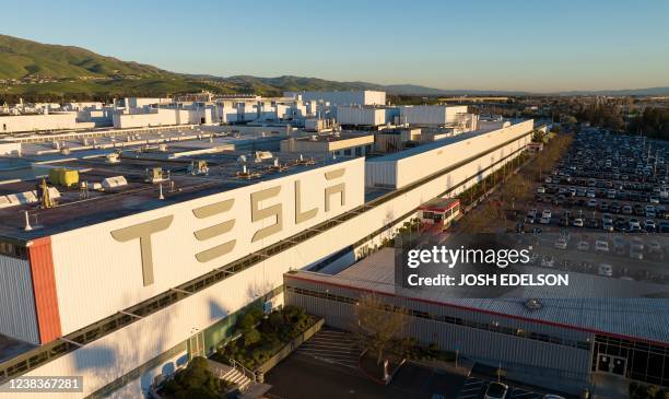 An aerial view shows the Tesla Fremont Factory in Fremont, California on February 10, 2022. - Tesla can hardly make enough electric vehicles to meet...