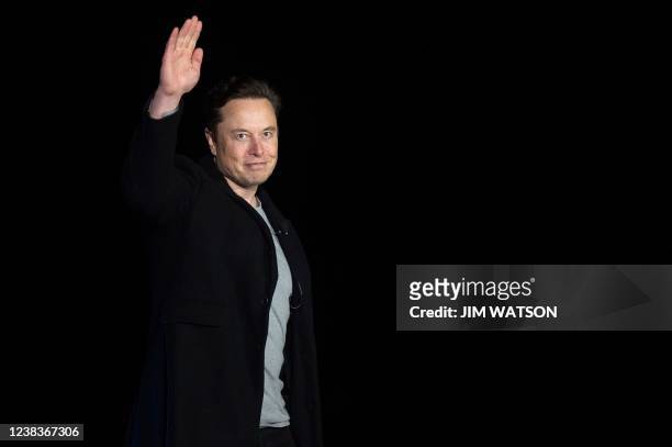 Elon Musk gestures as he speaks during a press conference at SpaceX's Starbase facility near Boca Chica Village in South Texas on February 10, 2022....