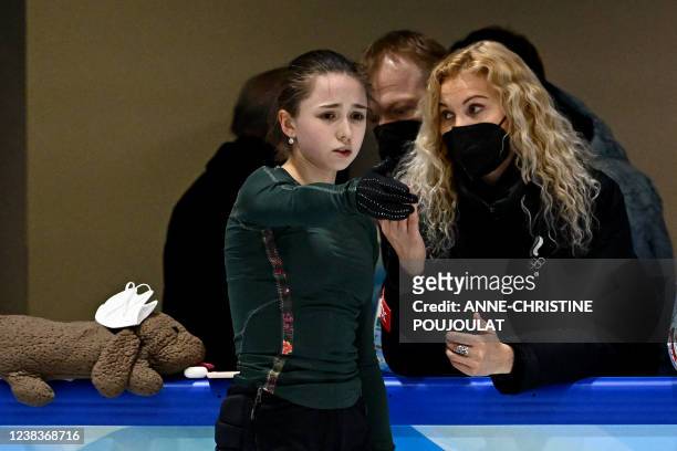 Russia's Kamila Valieva and her coach Eteri Tutberidze attend a training session on February 11, 2022 prior the Figure Skating Event at the Beijing...