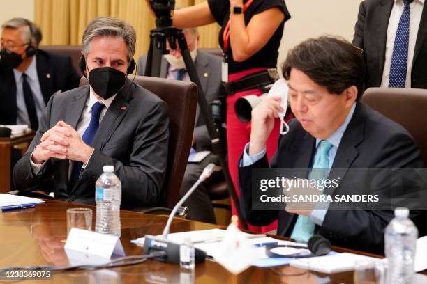 Secretary of State Antony Blinken listens as Japan's Foreign Minister Yoshimasa Hayashi makes opening remarks during a meeting of the Quadrilateral...