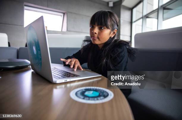 Mexican genius girl, Adhara Perez Sanchez, uses a laptop at the Reforma Tower, in Mexico City, Mexico on February 11, 2022. The 10-year-old girl...