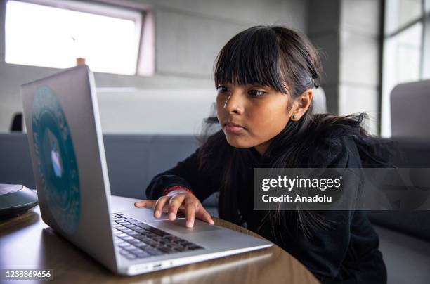 Mexican genius girl, Adhara Perez Sanchez, uses a laptop at the Reforma Tower, in Mexico City, Mexico on February 11, 2022. The 10-year-old girl...