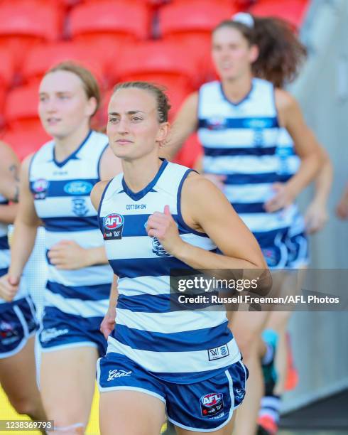 Georgie Rankin of the Cats runs out during the 2022 AFLW Round 06 match between the Gold Coast Suns and the Geelong Cats at Metricon Stadium on...