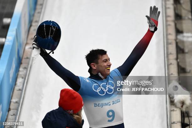 Britain's Matt Weston reacts at the end of his run in the men's skeleton gold medal event at the Yanqing National Sliding Centre during the Beijing...