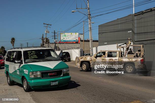 Members of the Mexican Army patrol an area near the Tijuana International Airport in Tijuana, Mexico, on Thursday, Feb. 10, 2022. 2,000 members of...