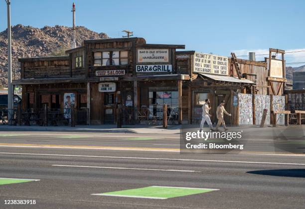 Pedestrians in Joshua Tree, California, U.S., on Saturday, Feb. 5, 2022. Joshua Tree, a small community outside Palm Springs, has a larger supply of...