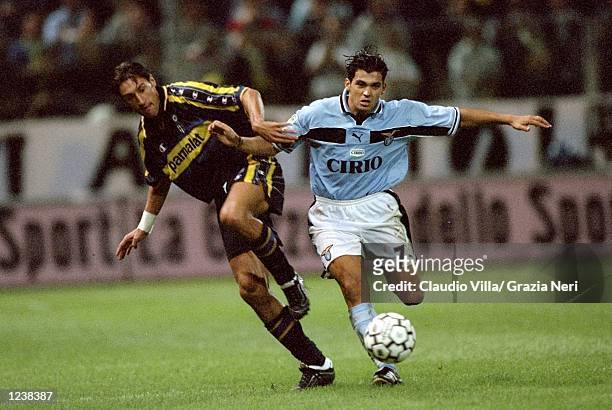Diego Fuser of Parma battles with Sergio Conceicao of Lazio during the Serie A match between Parma and Lazio played at the Stadio Ennio Tardini,...