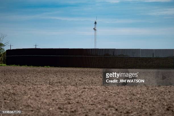 An electronic observation tower looks out over the border fence in Brownsville, Texas, on February 11, 2022. Texas Republican Governor Greg Abbott...