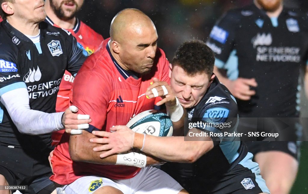 Rugby Rut Warriors Duncan weir challenges Munster's Simon Zebo during a United ...