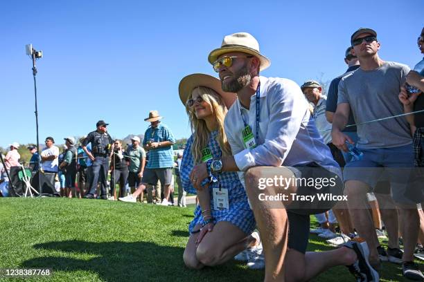 Candace Cameron Bure and Val Bure watch Canadian Roger Sloan at the third tee during the second round of the WM Phoenix Open at TPC Scottsdale on...