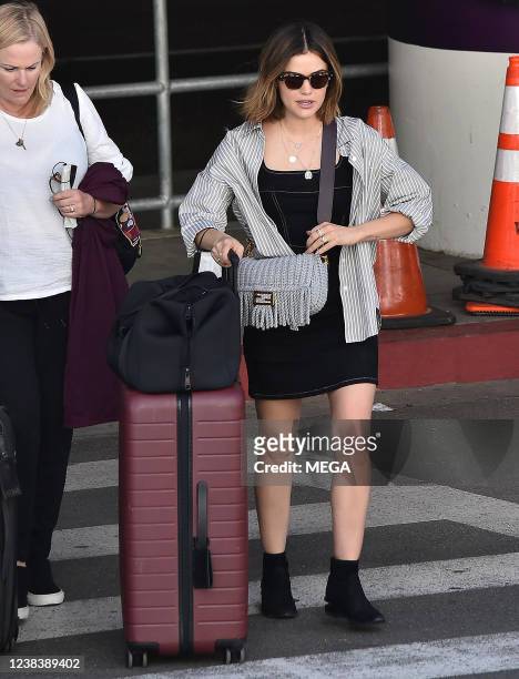 Lucy Hale is seen arriving at LAX airport on February 10, 2022 in Los Angeles, California.