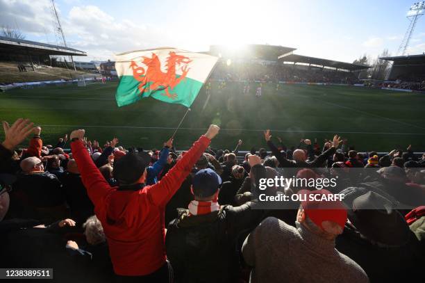 Supporters celebrate Wrexham Association Football Club's first goal during a National League fixture football match against Maidenhead United, at the...