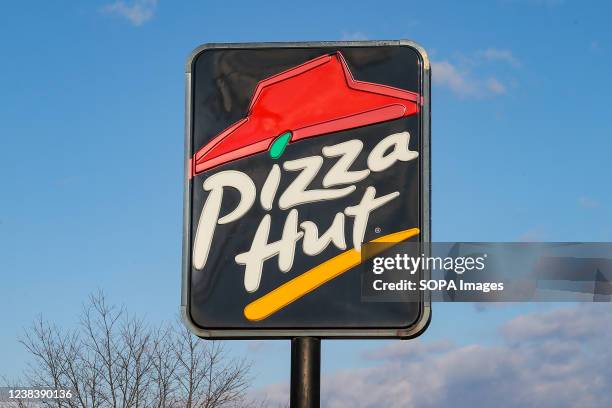View of a Pizza Hut restaurant sign and logo.