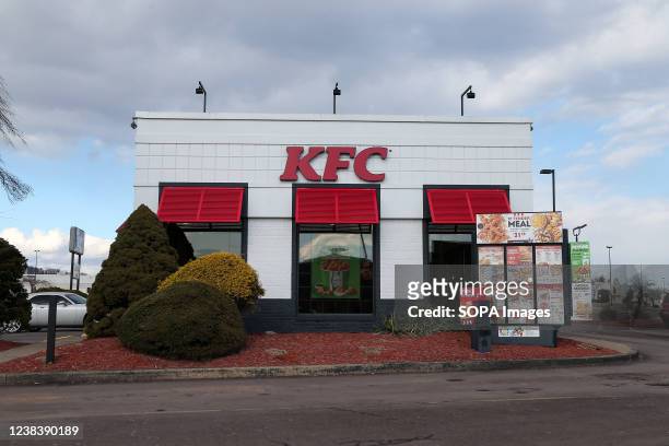 View of a KFC restaurant sign and logo.