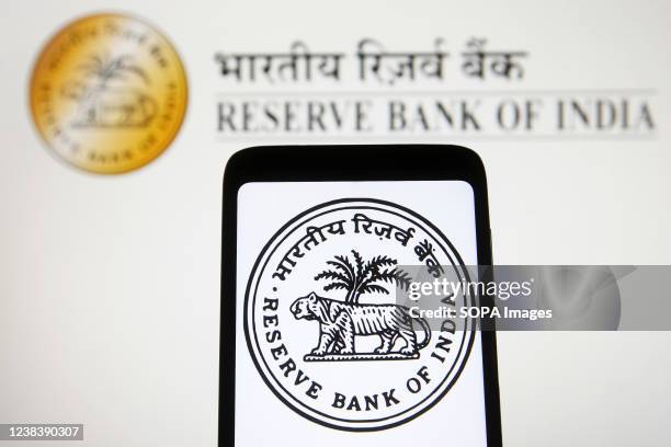 In this photo illustration, a Reserve Bank of India seal is seen on a smartphone screen.