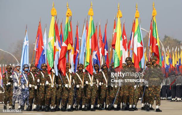 Myanmar junta military soldiers parade during a ceremony to mark the 75th anniversary of the country's Union Day in Naypyidaw on February 12, 2022.