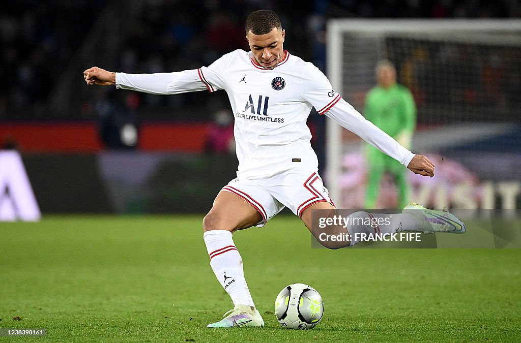 Paris Saint Germain s French Forward Kylian Mbappe Kicks The Ball paris-saint-germain-s-french-forward-kylian-mbappe-kicks-the-ball