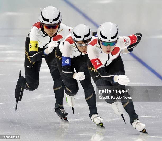 Japanese speed skaters Ayano Sato, Nana Takagi and Miho Takagi compete in the women's team pursuit quarterfinals at the Beijing Winter Olympics on...
