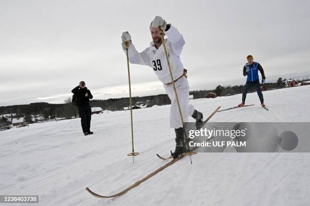 Sweden's Anders Sodergren passes through Oxberg, Sweden on February 12, 2022 during the Vasaloppet ski race from Sälen to Mora. - 139 skiers compete...