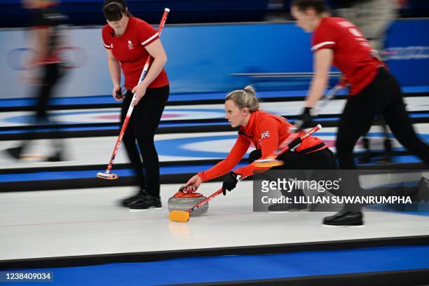 Great Britain's Vicky Wright curls the stone during the womens round robin session 5 game of the Beijing 2022 Winter Olympic Games curling...