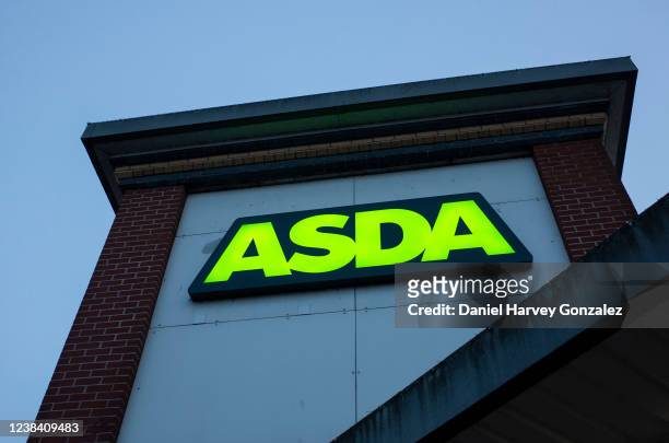 The logo for British supermarket chain Asda is lit up in its signature green in the evening on 11th February, 2022 in Leeds, United Kingdom.