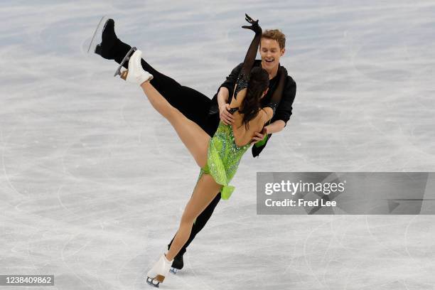 Madison Chock and Evan Bates of Team United States react after skating during the Ice Dance Rhythm Dance on day eight of the Beijing 2022 Winter...