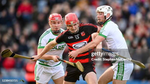 Dublin , Ireland - 12 February 2022; Billy O'Keeffe of Ballygunner in action against Kevin Mullen, right, and Darren Mullen of Shamrocks during the...