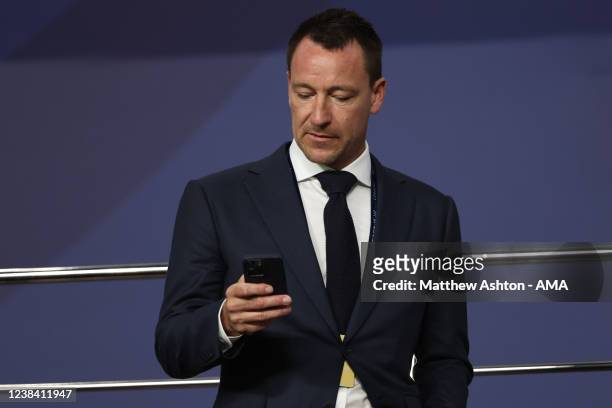 John Terry the academy coaching consultant at Chelsea on his mobile phone during the FIFA Club World Cup UAE 2021 Final match between Chelsea v...